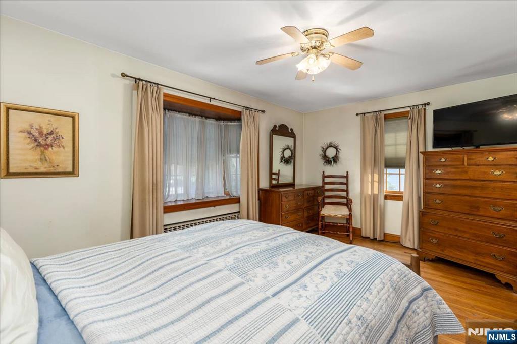 618 3rd Avenue Lyndhurst, NJ 07071 - Photo 18 of 33 a bedroom with a bed and a flat screen tv