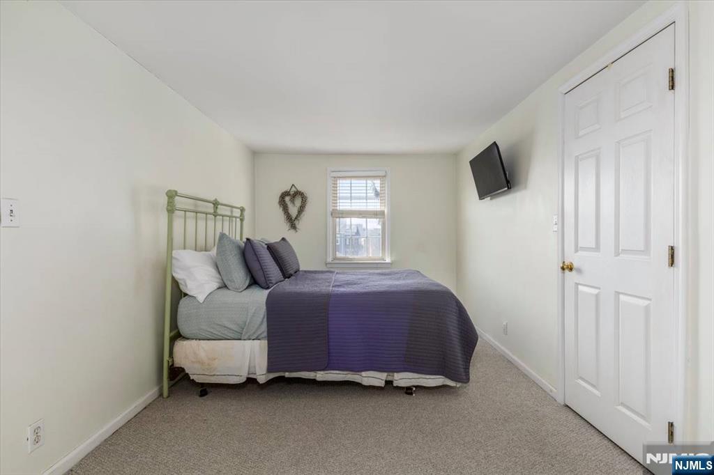 618 3rd Avenue Lyndhurst, NJ 07071 - Photo 21 of 33 a bedroom with a bed and a window