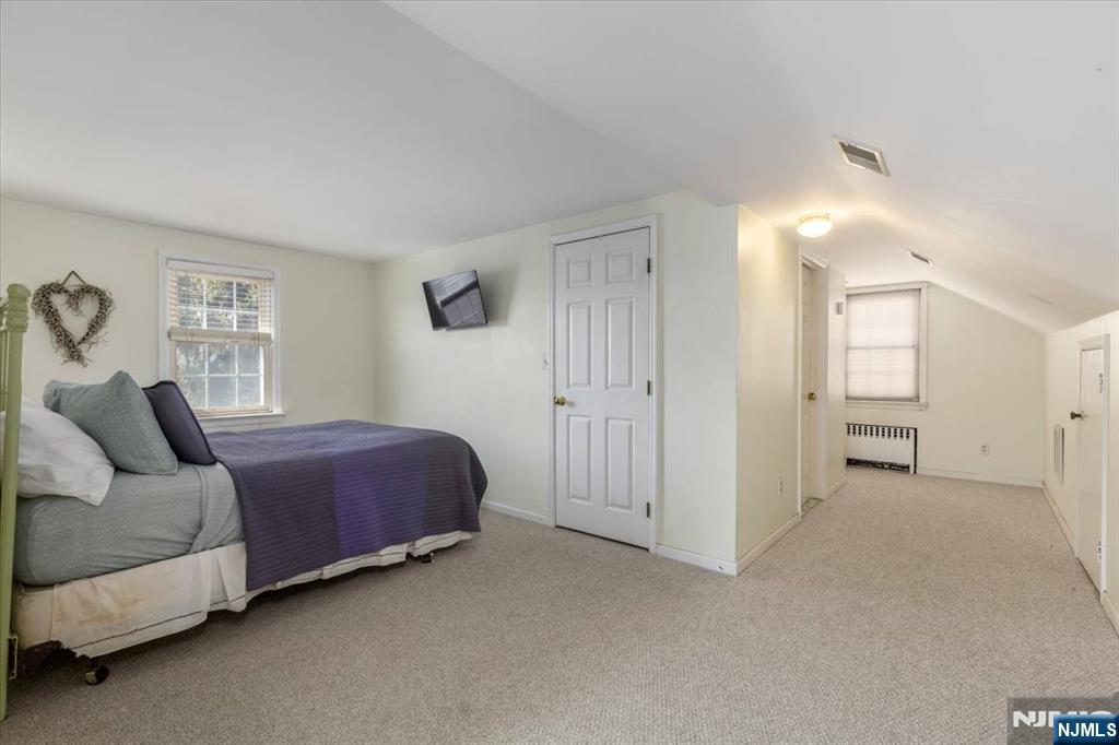 618 3rd Avenue Lyndhurst, NJ 07071 - Photo 23 of 33 a living room with a bed and furniture