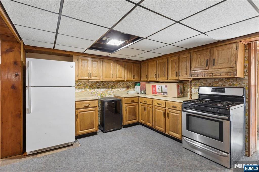 618 3rd Avenue Lyndhurst, NJ 07071 - Photo 24 of 33 a kitchen with a stove sink and refrigerator