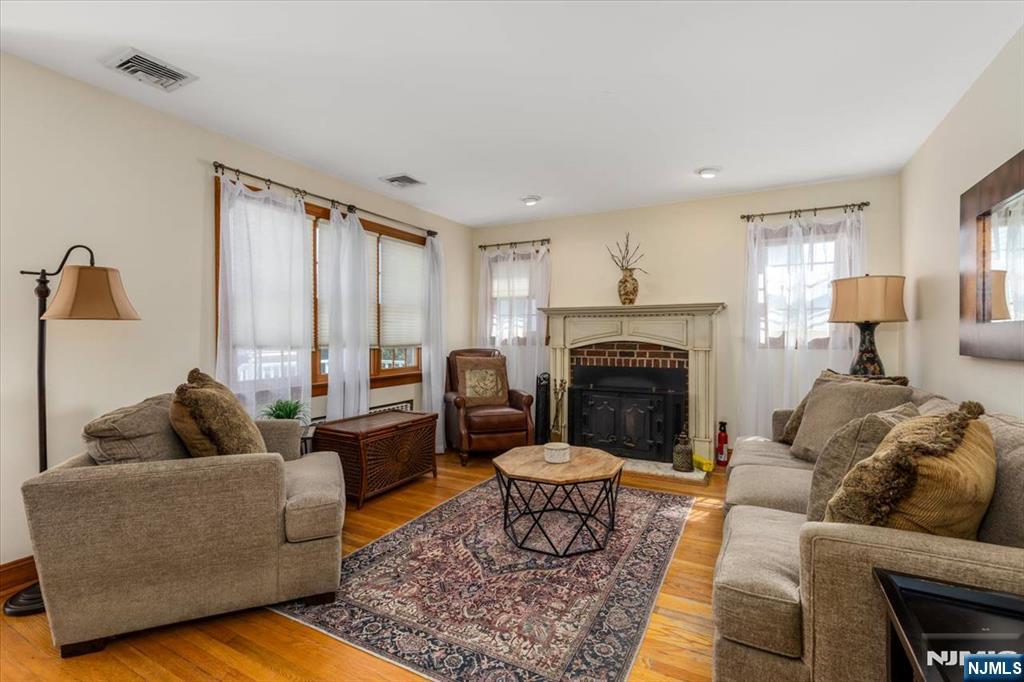 618 3rd Avenue Lyndhurst, NJ 07071 - Photo 4 of 33 a living room with furniture and a fireplace
