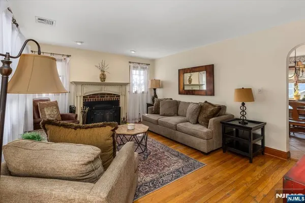 a dining room with furniture a chandelier and window