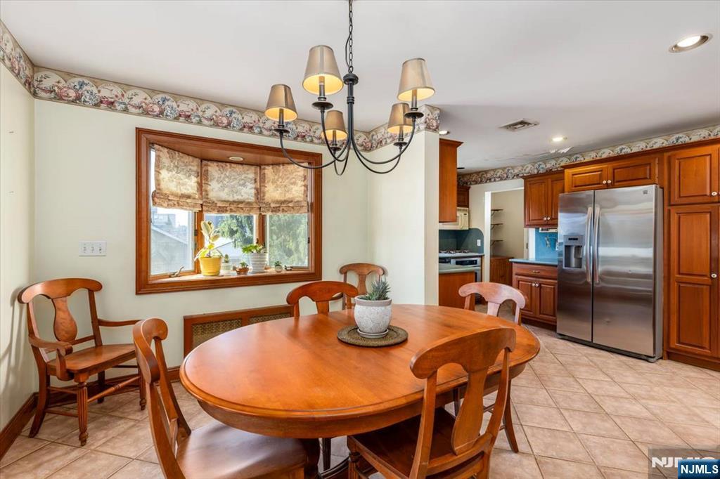 618 3rd Avenue Lyndhurst, NJ 07071 - Photo 8 of 33 a dining room with furniture a chandelier and window