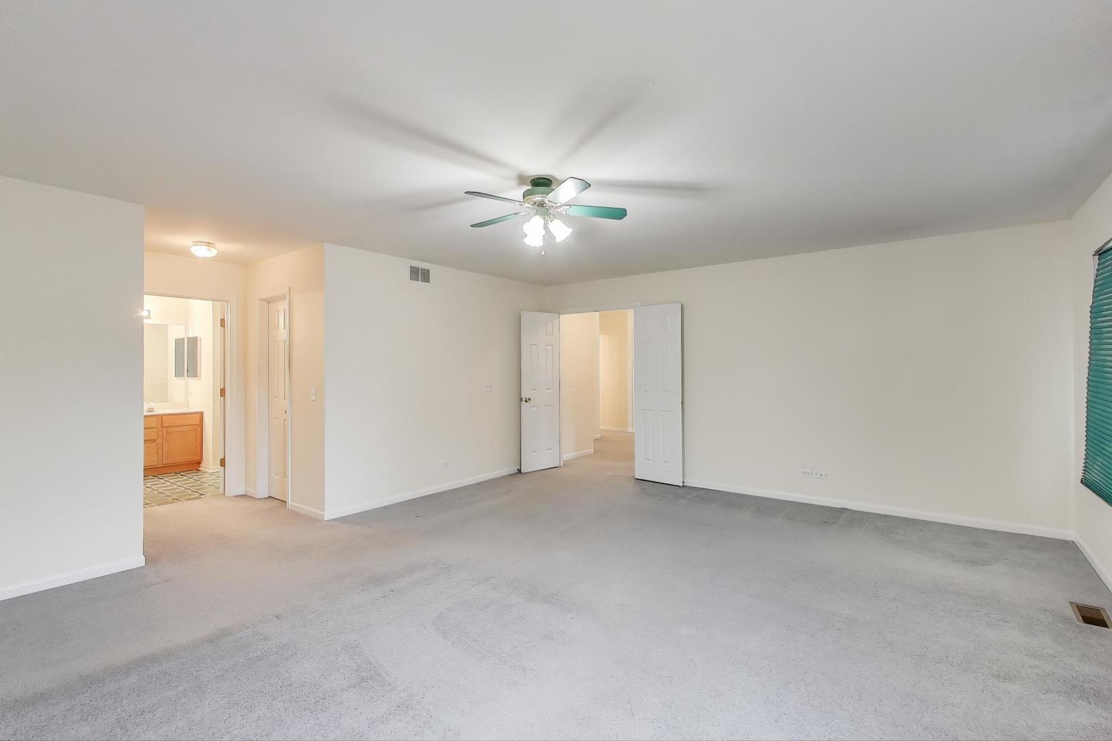 697 Providence Lane Lindenhurst, IL 60046 - Photo 15 of 31 an empty room with fan and a ceiling fan