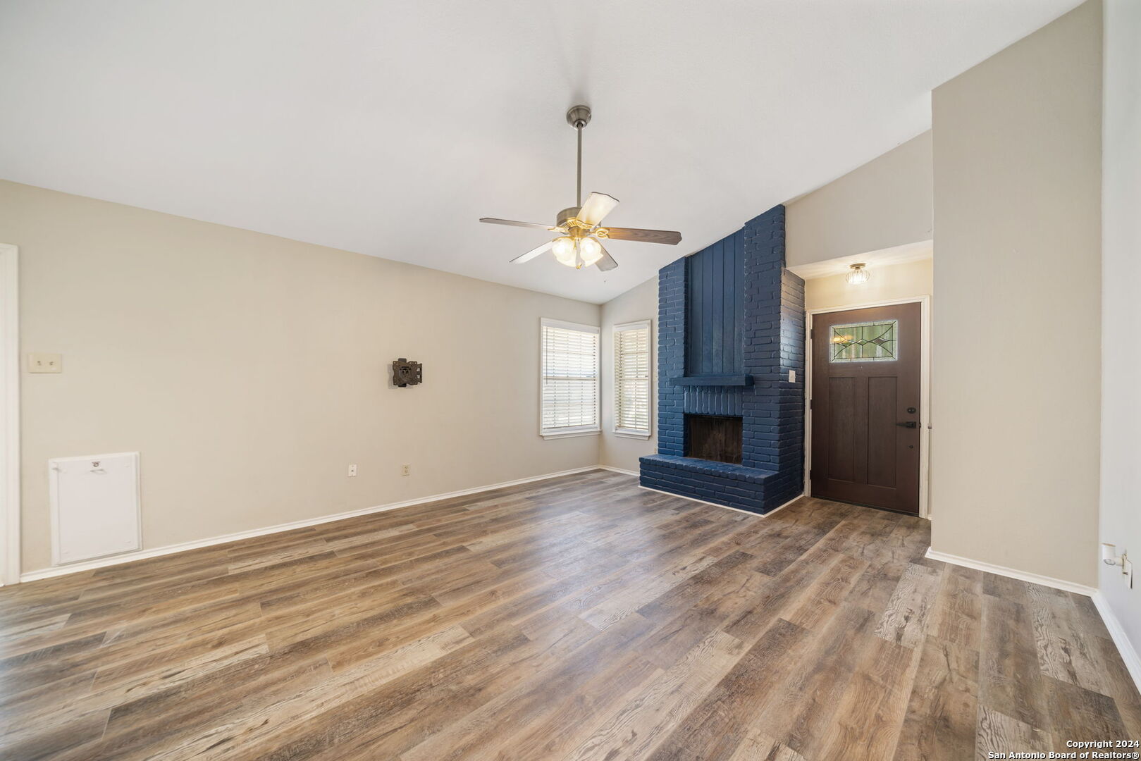 12106 Ridge Ct Street San Antonio, TX 78247 - Photo 12 of 25 a view of a room with wooden floor and fireplace