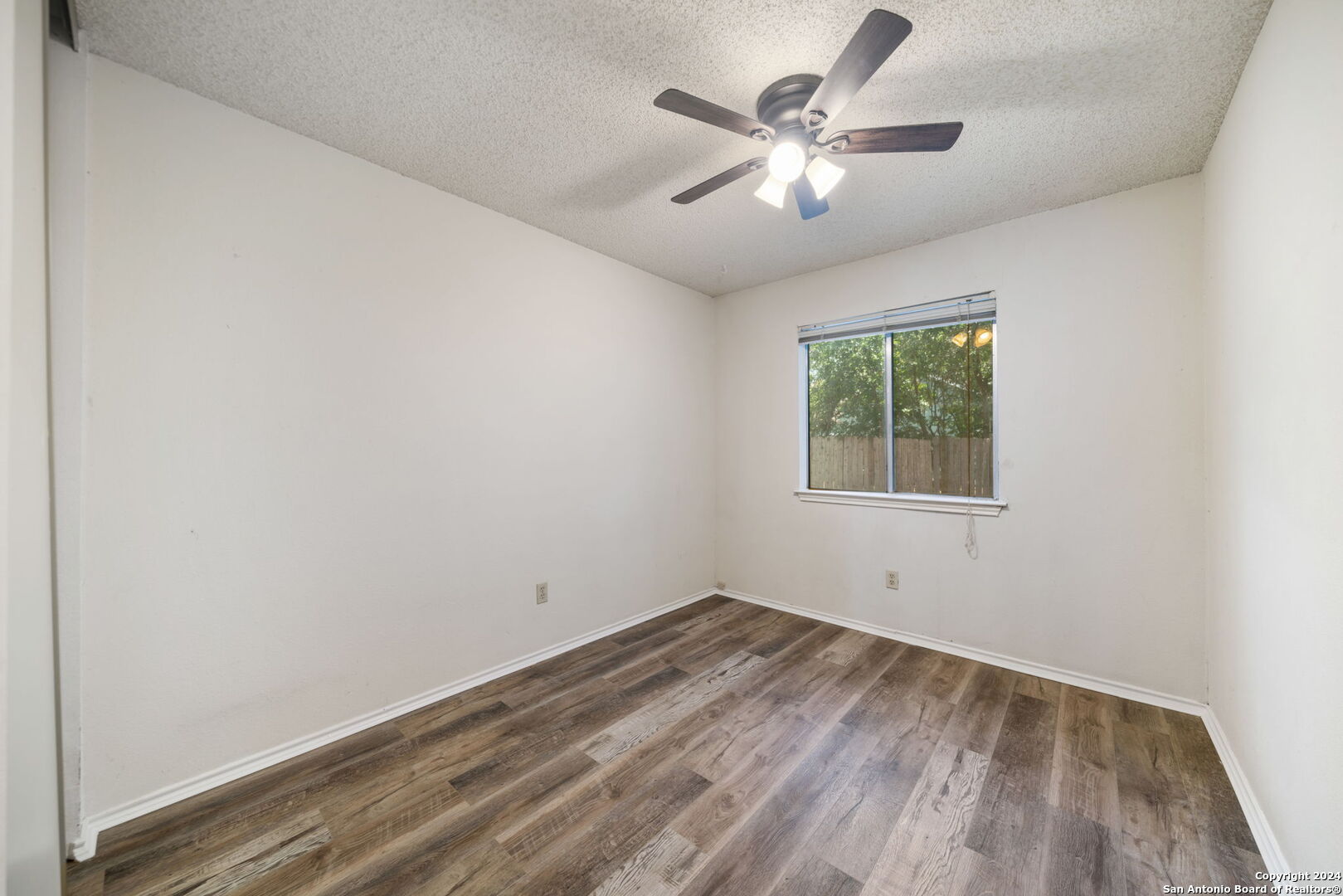 12106 Ridge Ct Street San Antonio, TX 78247 - Photo 17 of 25 an empty room with a window