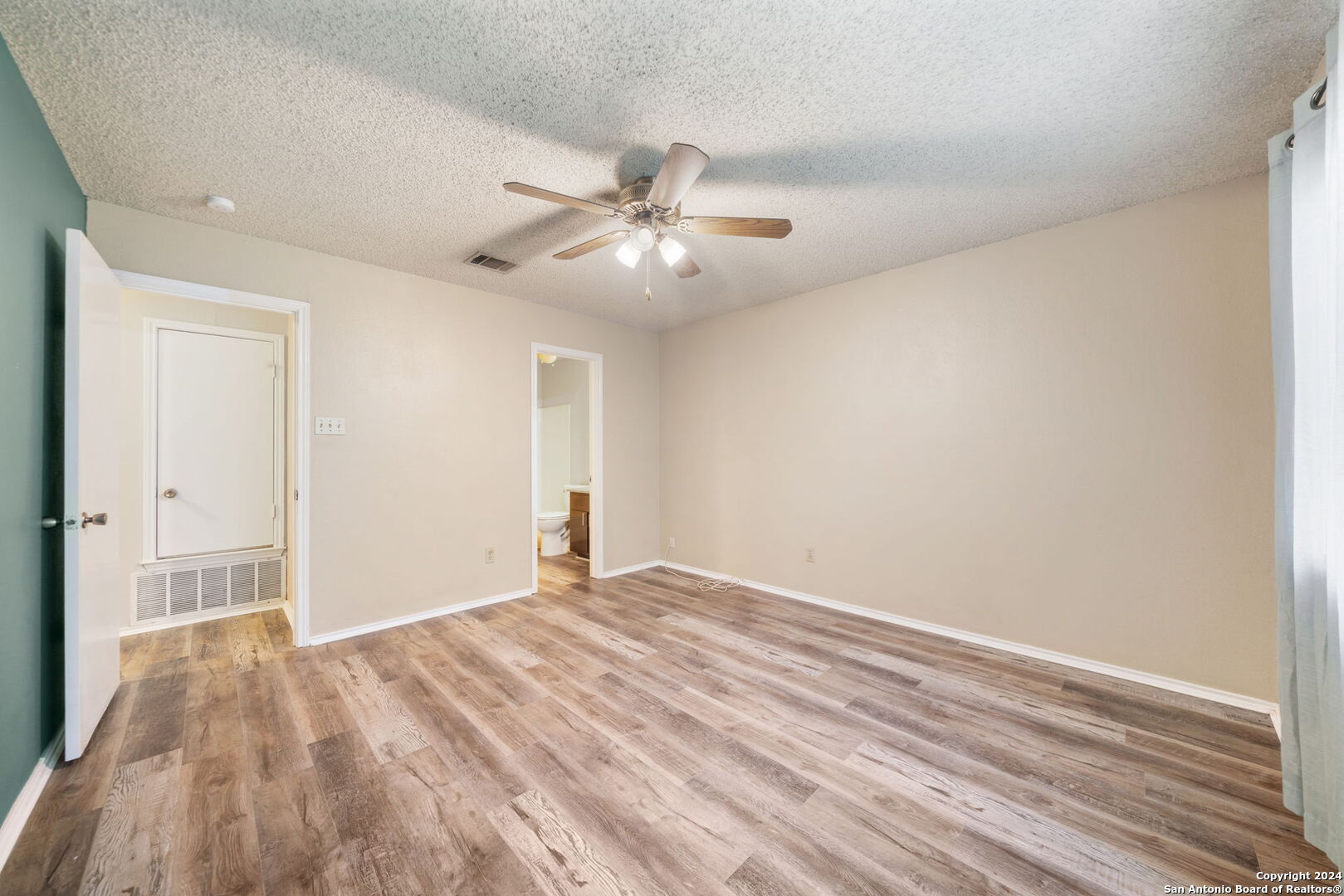 12106 Ridge Ct Street San Antonio, TX 78247 - Photo 20 of 25 a view of empty room with wooden floor