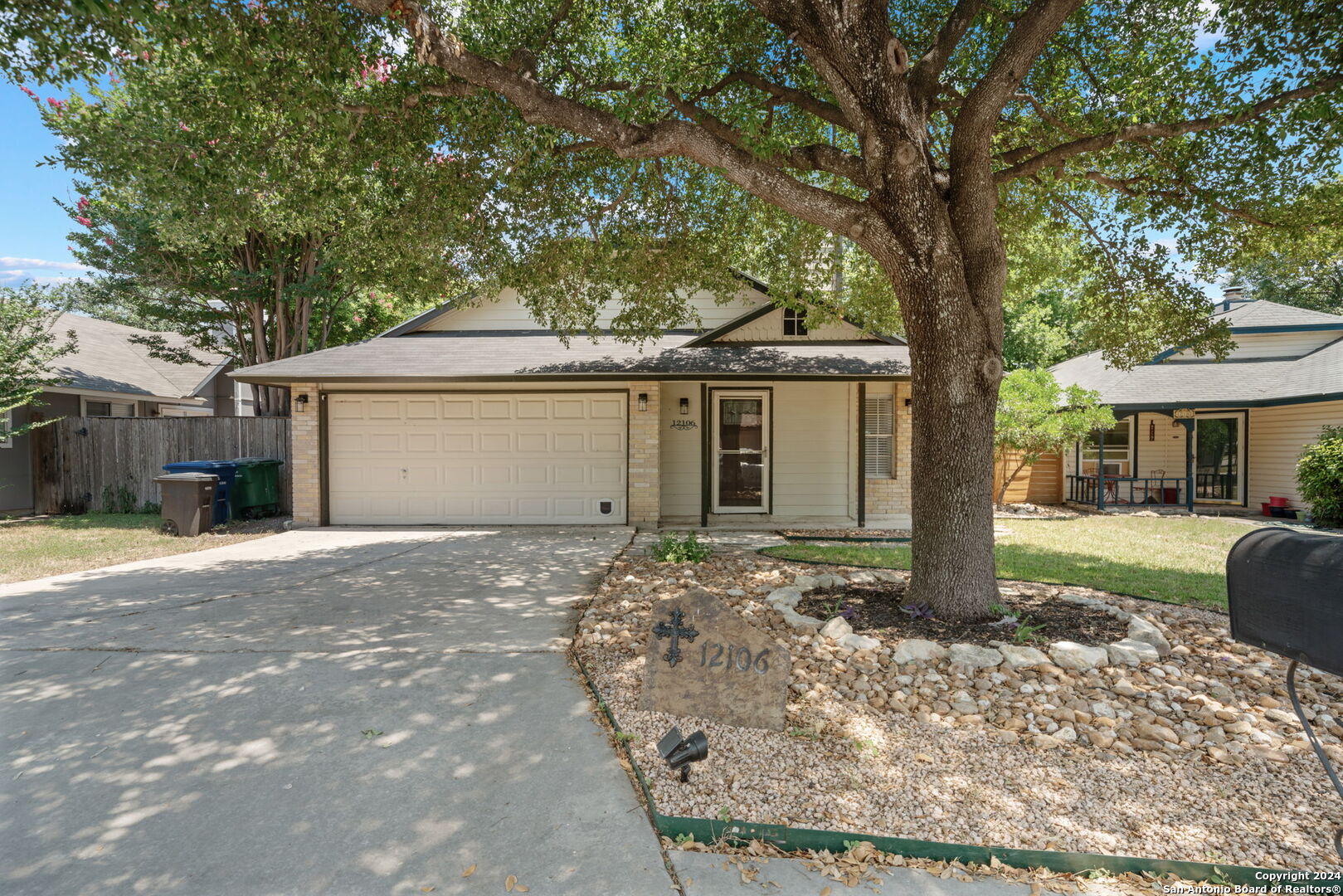 12106 Ridge Ct Street San Antonio, TX 78247 - Photo 2 of 25 a front view of a house with a yard and potted plants