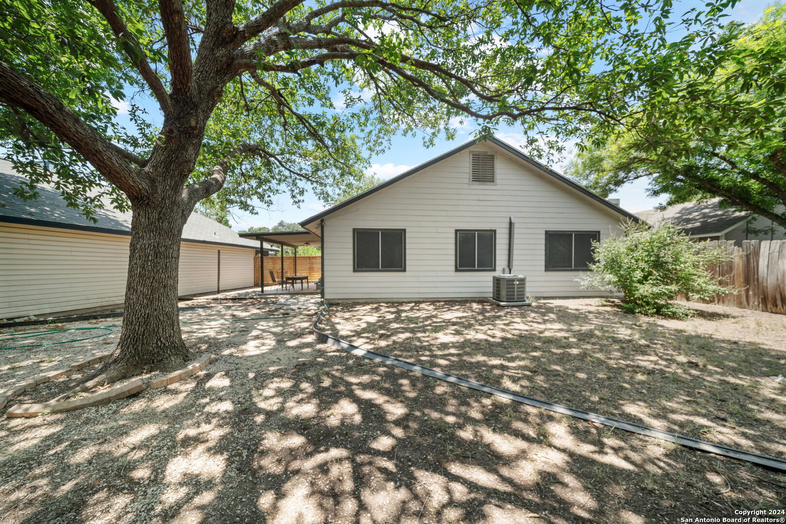 12106 Ridge Ct Street San Antonio, TX 78247 - Photo 25 of 25 a view of a house with a tree in the background