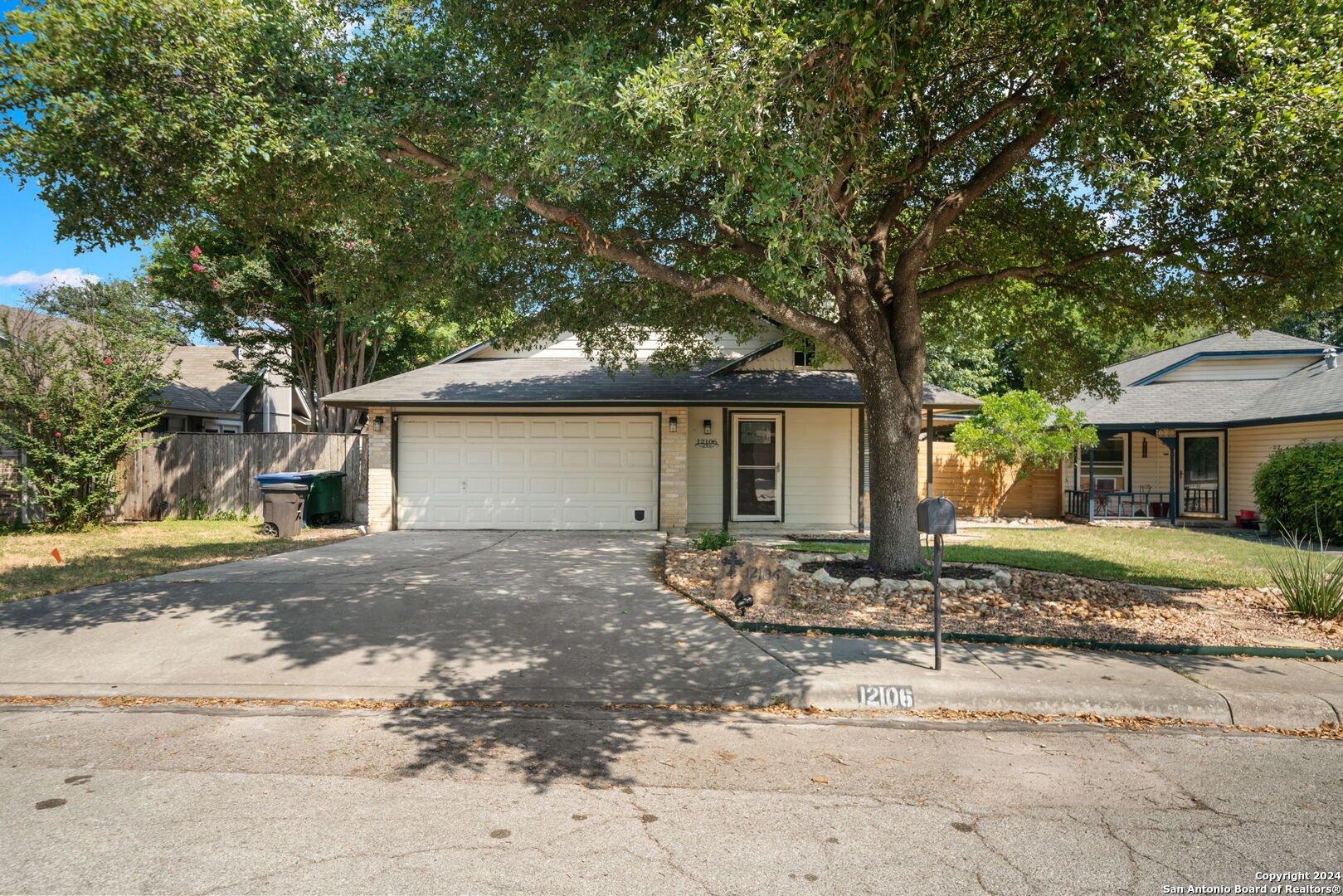 12106 Ridge Ct Street San Antonio, TX 78247 - Photo 5 of 25 a front view of a house with a yard and trees