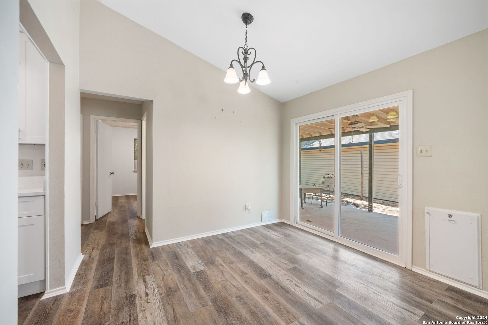 12106 Ridge Ct Street San Antonio, TX 78247 - Photo 7 of 25 wooden floor in an empty room with a window