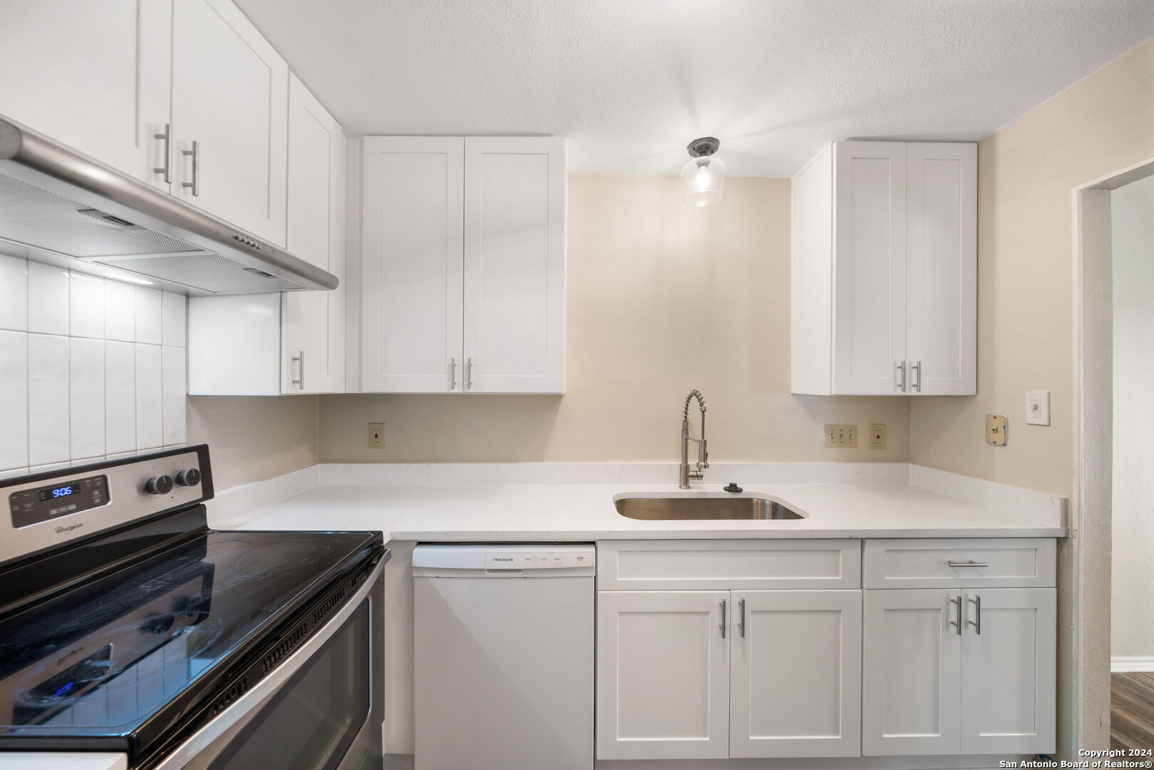 12106 Ridge Ct Street San Antonio, TX 78247 - Photo 8 of 25 a kitchen with white cabinets and sink