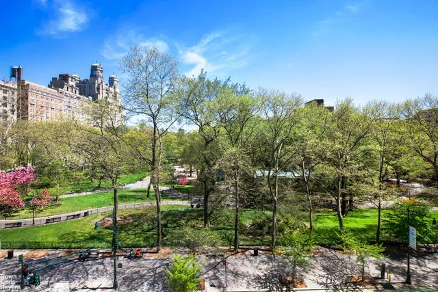 a view of a house with a yard and garden