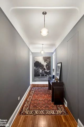 a view of a livingroom with furniture window and wooden floor