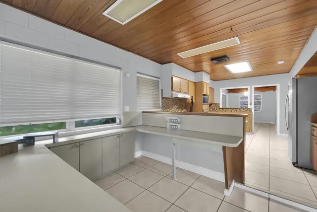 a kitchen with counter top space and appliances