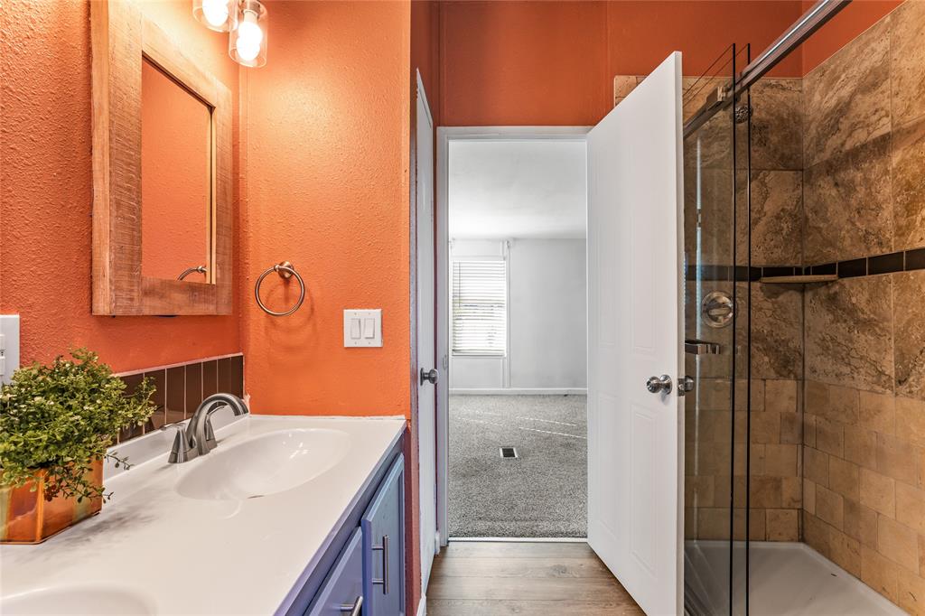 112 Pine Ridge Circle Southmayd, TX 75092 - Photo 12 of 25 a bathroom with a sink and a mirror