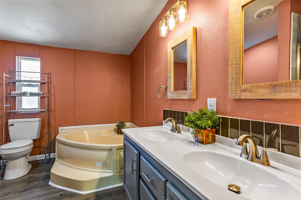 112 Pine Ridge Circle Southmayd, TX 75092 - Photo 13 of 25 a bathroom with a sink and a toilet