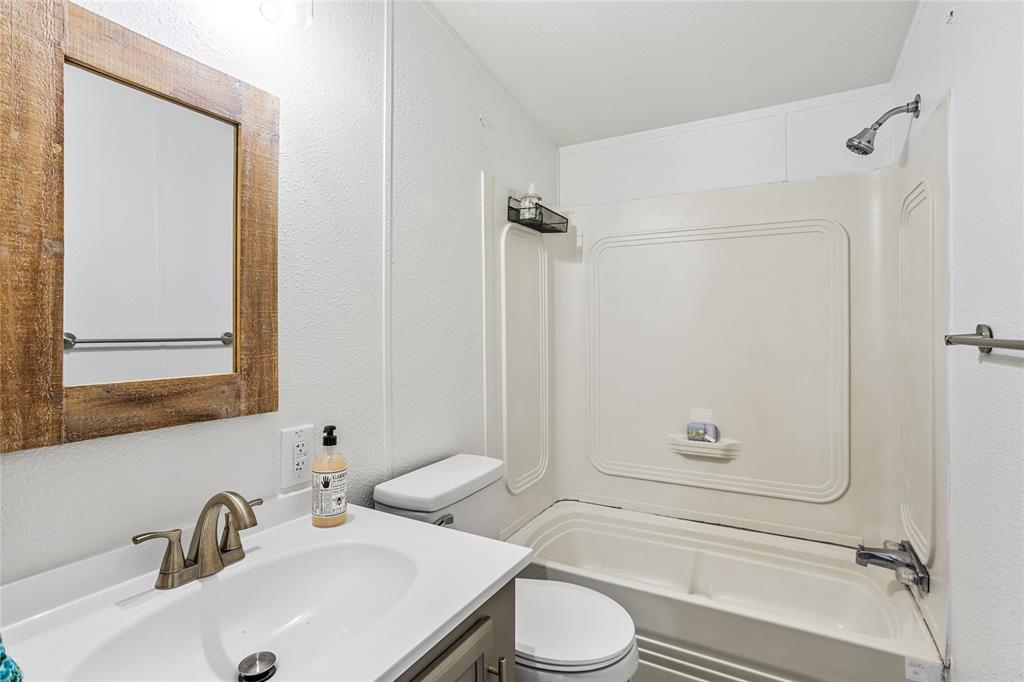 112 Pine Ridge Circle Southmayd, TX 75092 - Photo 16 of 25 a bathroom with a sink toilet and shower