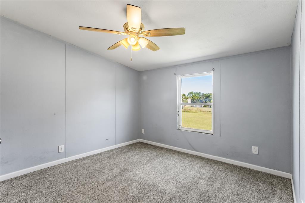 112 Pine Ridge Circle Southmayd, TX 75092 - Photo 18 of 25 wooden floor in an empty room with a window
