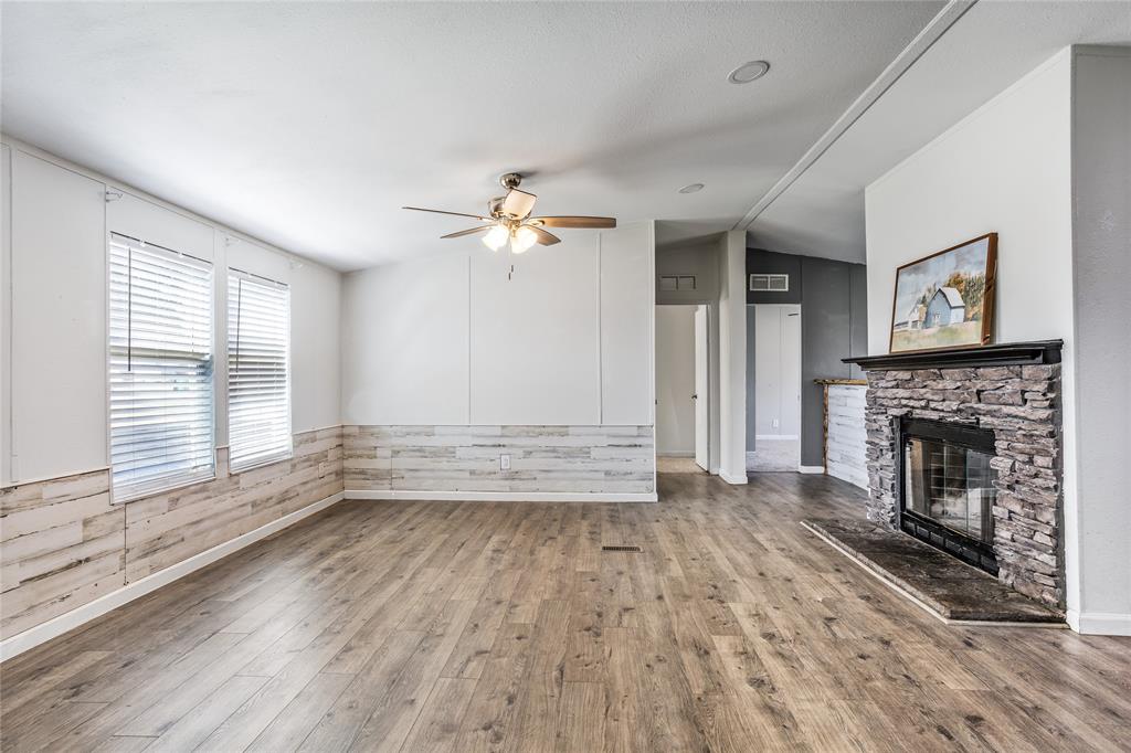 112 Pine Ridge Circle Southmayd, TX 75092 - Photo 6 of 25 a view of empty room with wooden floor and fan