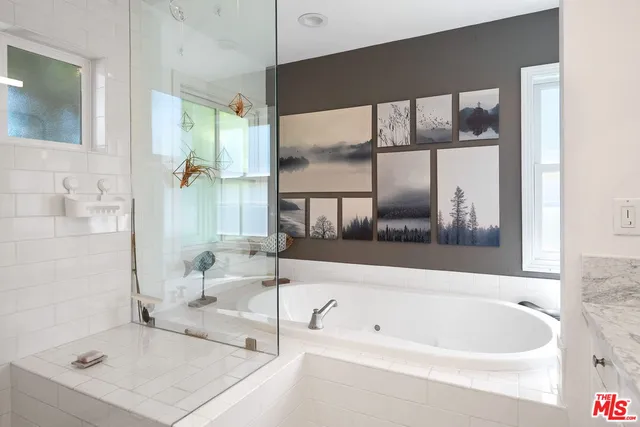 a bathroom with a bathtub and a sink