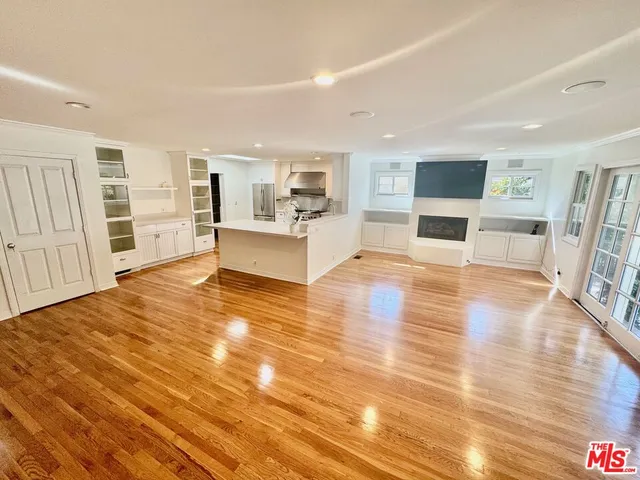 a view of a livingroom with furniture wooden floor and window