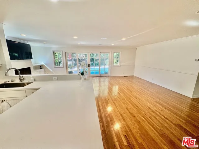 a view of a livingroom with furniture and a flat screen tv
