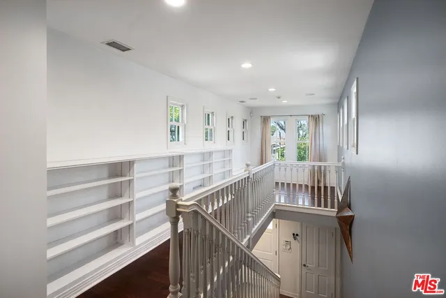a view of entryway with workspace and stairs