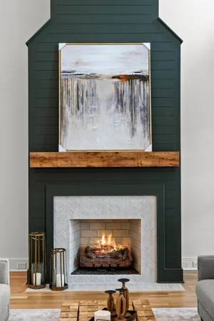 a living room with furniture and a view of kitchen