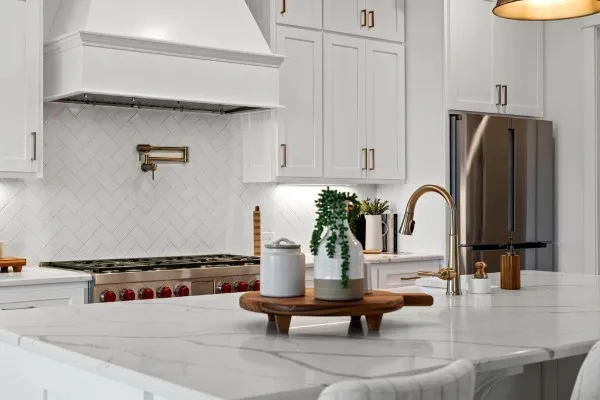 a kitchen with a table chairs and wooden floor