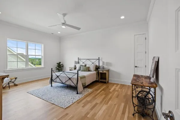 a bathroom with a granite countertop sink a toilet and a mirror