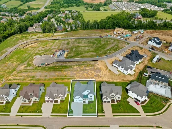 a view of swimming pool with a table and chairs