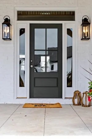a dining room with wooden floor and a chandelier