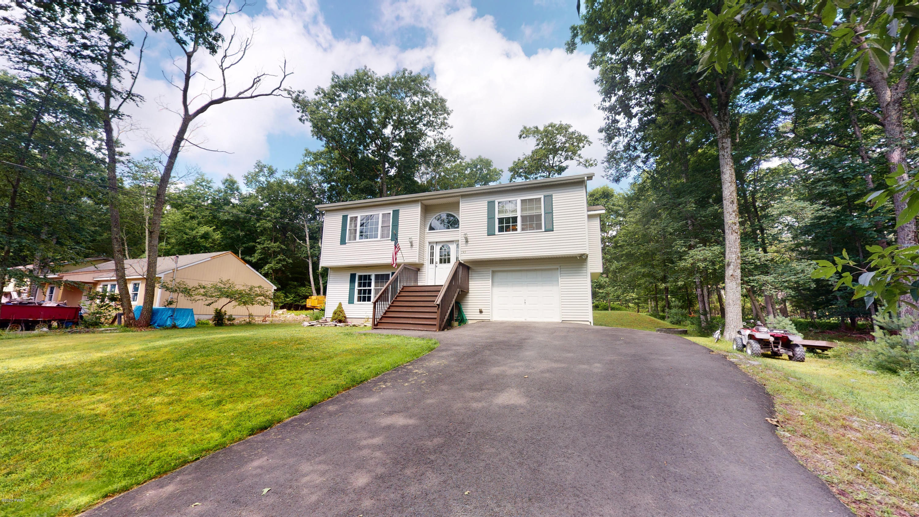 143 Raccoon Road Dingmans Ferry, PA 18328 - Photo 18 of 87 a view of a house with backyard and trees