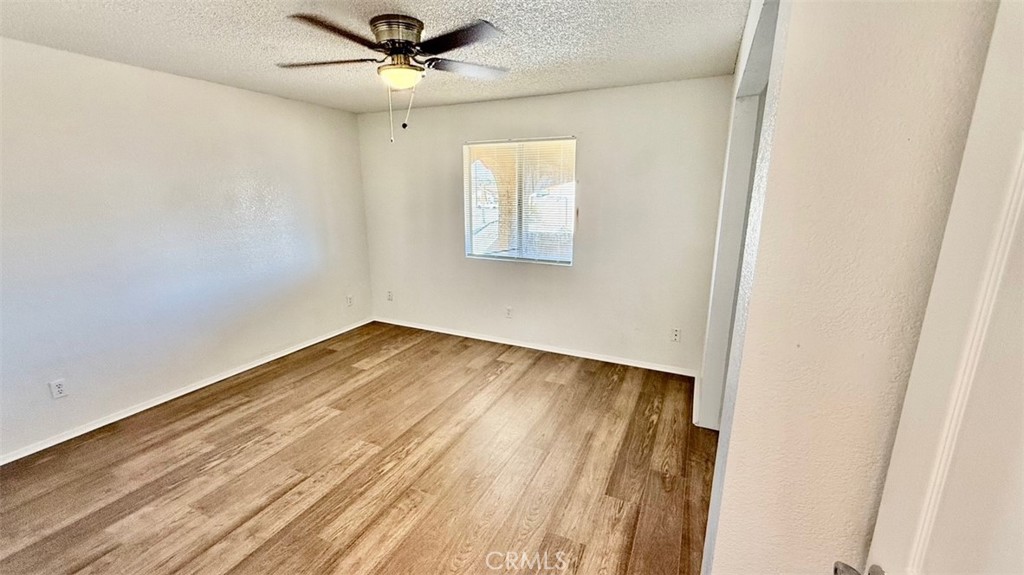 16026 K Street Mojave, CA 93501 - Photo 6 of 10 wooden floor in an empty room