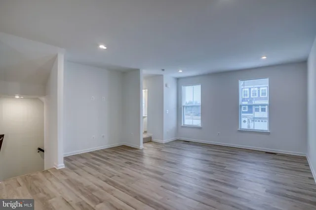 a view of a kitchen with stainless steel appliances granite countertop a large counter top and oven