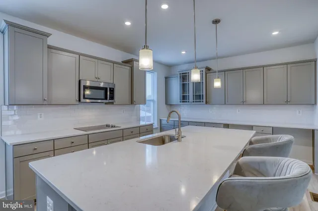 a bathroom with a sink and a window