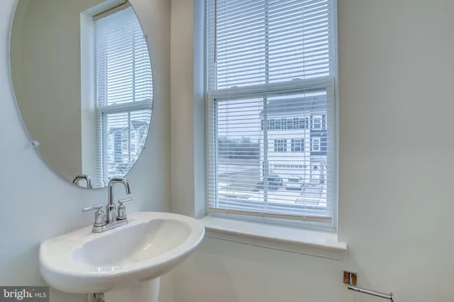 a living room with furniture and windows