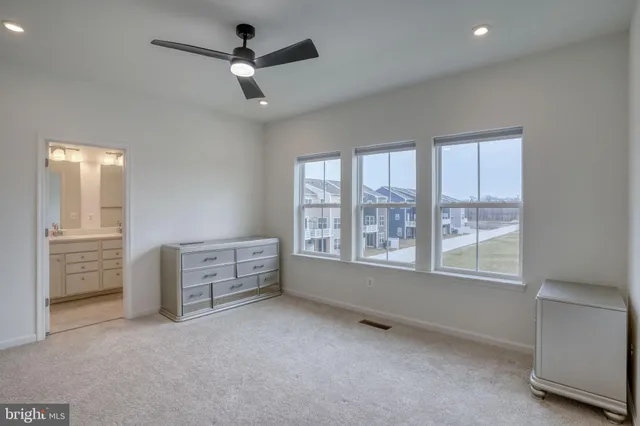 a bathroom with a double vanity sink mirror and shower