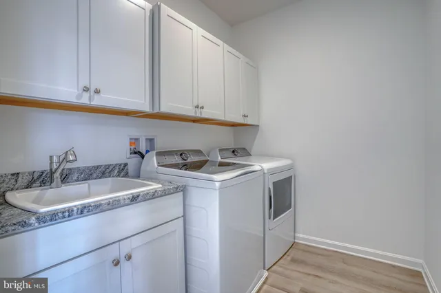 a bathroom with a sink toilet tub and shower