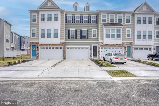 a view of a house with swimming pool and sitting area