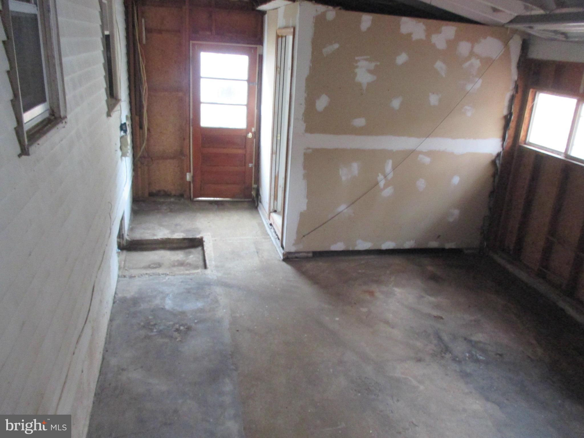 540 Londontown Road Edgewater, MD 21037 - Photo 12 of 14 a view of a hallway with wooden floor and windows