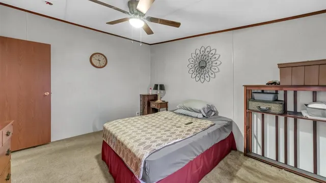 a bedroom that has a bed and a table in it
