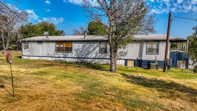 a view of a house with swimming pool