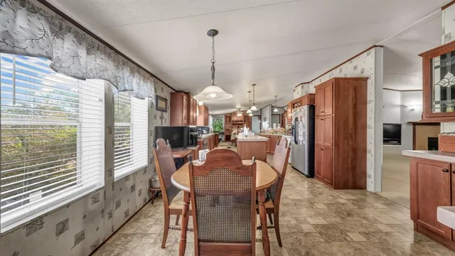 a dining room with furniture and window