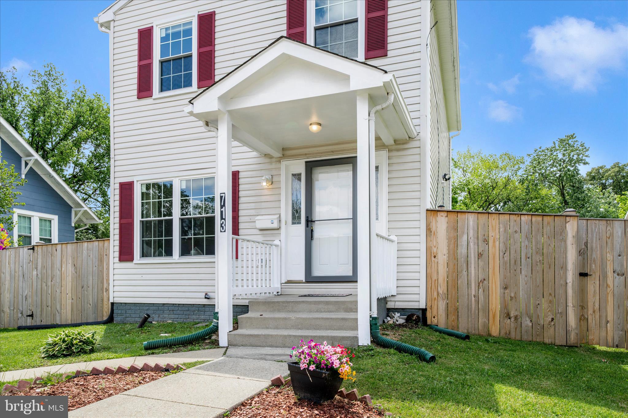 713 Seek Lane Silver Spring, MD 20912 - Photo 2 of 60 a front view of a house with garden