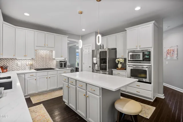 a living room with furniture and a lamp