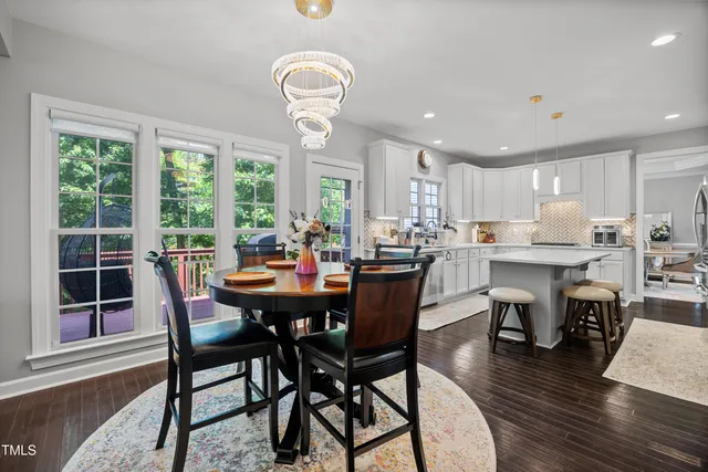 a white stove top oven sitting inside of a kitchen