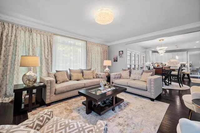 a kitchen with granite countertop white cabinets and chairs