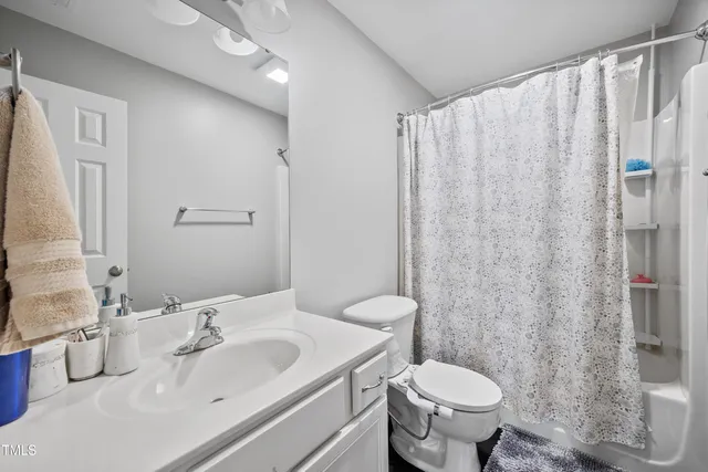 a spacious bathroom with a bathtub and a shower
